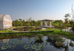 Veranda sitting with view of lake and greenery